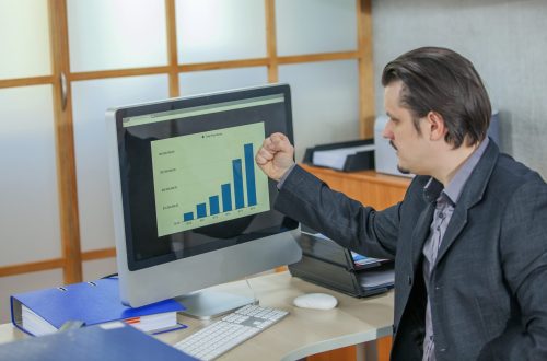 Young businessman working from his office – the concept of success A young businessman working from his office - the concept of success